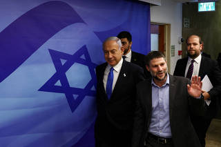 FILE PHOTO: Israeli Prime Minister Benjamin Netanyahu and Finance Minister Bezalel Smotrich arrive to attend a cabinet meeting at the Prime Minister's office in Jerusalem