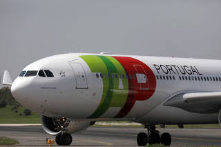 FILE PHOTO: One of Portuguese airline TAP's A330-200 planes taxis at Lisbon airport