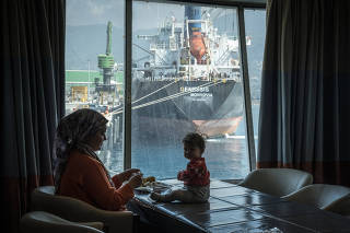 A view of another boat from the cruise ship Gemini, one of at least four floating solutions in Hatay province to housing some of the residents displaced by the earthquake, in the port of Iskenederun, Turkey, Feb. 24, 2023. (Sergey Ponomarev/The New York Ti