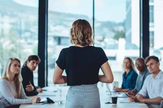 Female business leader conducting a meeting