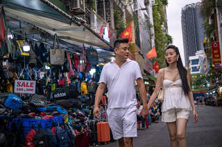 Jeffrey Chue and his wife Nguyen Thi Anh Thy in Ho Chi Minh City, Vietnam, Jan. 27, 2023. (Linh Pham/The New York Times)