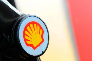 FILE PHOTO: A Shell logo is seen on a pump at a petrol station in London
