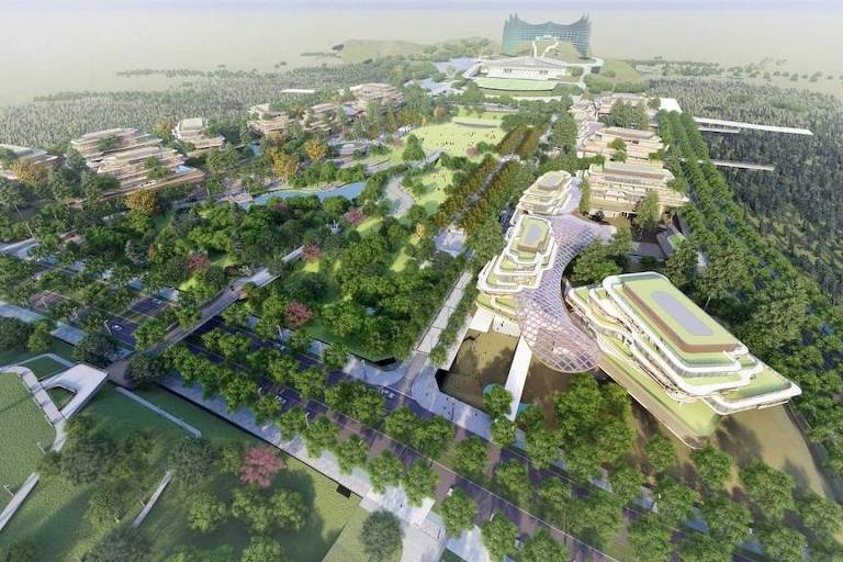 a imagem, criada digitalmente, é a vista aérea do projeto da cidade de Nusantara, destacando-se por prédios futuristas e muitas áreas verdes