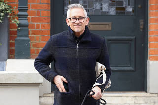 Former British football player and BBC presenter Gary Lineker leaves his home in London
