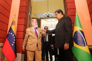 Venezuela's President Nicolas Maduro and Brazil's envoy Celso Amorim meet, in Caracas