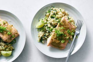 A one-pot salmon and rice with coconut milk and greens in New York, Dec. 19, 2022. Food Stylist: Simon Andrews. (David Malosh/The New York Times)