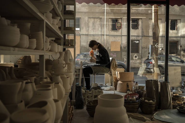 An employee works at the Otkhi ceramic factory in Tbilisi, Georgia on Dec. 17, 2022. With Russian and Ukrainian potters on their staff, Otkhi established production of artisan vases, cups, and other ceramic products in central Tbilisi.(Sergey Ponomarev/The New York Times)