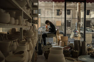An employee works at the Otkhi ceramic factory in Tbilisi, Georgia on Dec. 17, 2022. (Sergey Ponomarev/The New York Times)