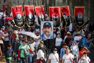 Supporters of President Daniel Ortega and Vice President Rosario Murillo, attend a pro-government march in Managua
