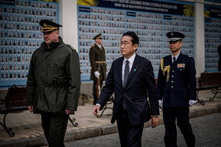 Japanese Prime Minister Fumio Kishida visits the Wall of Remembrance to pay tribute to killed Ukrainian soldiers, in Kyiv