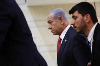 Israeli Prime Minister Benjamin Netanyahu leaves his office in the Knesset, Israel's Parliament, in Jerusalem