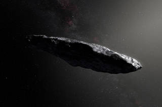 FILE PHOTO: Handout photo of an artist's impression of the first interstellar asteroid `Oumuamua as it passes through the solar system after its discovery