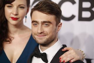 Actor Daniel Radcliffe arrives with girlfriend Erin Darke for the American Theatre Wing's 68th annual Tony Awards at Radio City Music Hall in New York