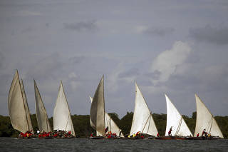 FILE PHOTO: Local Swahili dhows compete during the traditional race in Lamu