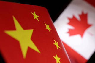 FILE PHOTO: Illustration shows printed Chinese and Canada flags