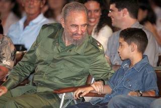 File photo of Cuba's President Castro speaking to Gonzalez in Santa Clara