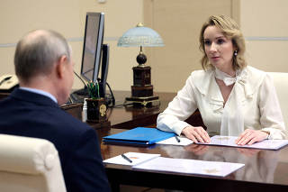 FILE PHOTO: Russian Presidential Commissioner for Children's Rights Maria Lvova-Belova meets with Russian President Vladimir Putin outside Moscow