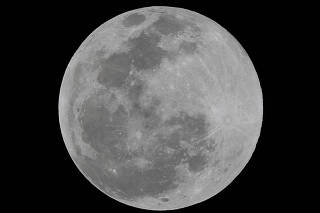FILE PHOTO: A full moon is seen over Mexico City