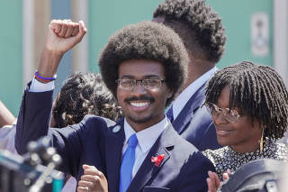 Justin J. Pearson marches with supporters from the National Civil Rights Museum to the Shelby County Commission, in Memphis