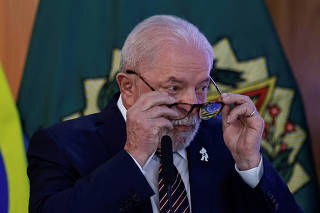 Brazil's President Luiz Inacio Lula da Silva gestures during a ministerial meeting to celebrate the first 100 days of his government, in Brasilia