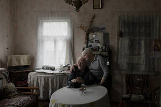 Halyna Markevych and her husband, Evgen, at their home in the Chernobyl Exclusion Zone in Ukraine, March 9, 2023. (Emile Ducke/The New York Times)