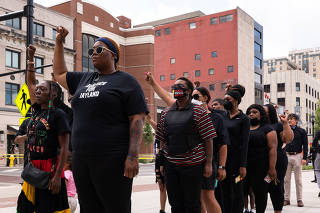 Mourners wait outside the entrance of the Civic Theater for a memorial service for Jayland Walker, 25, who was killed by the police, in Akron, Ohio, Wednesday, July 13, 2022. (Daniel Lozada/The New York Times)