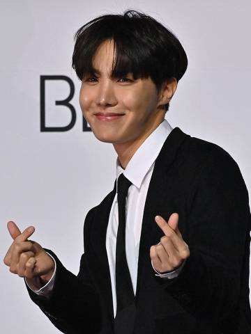 (FILES) In this file photo taken on November 20, 2020 South Korean K-pop boy band BTS member J-Hope poses for a photo session during a press conference on BTS new album 'BE (Deluxe Edition)' in Seoul. - BTS star J-Hope was set to start his mandatory South Korean military service on April 18, 2023 local media reported, the second member to report for duty since the K-pop juggernaut went on hiatus last year. (Photo by Jung Yeon-je / AFP)