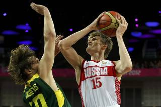 Russia's Kirilenko shoots over Lithuania's Jasaitis during their men's quarterfinal basketball match at the North Greenwich Arena in London during the London 2012 Olympic Games