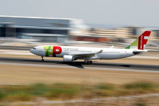 FILE PHOTO: A TAP Air Portugal Airbus A330 plane lands at Lisbon's airport