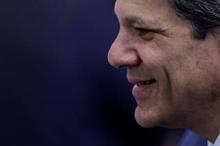 Brazil?s Finance Minister Fernando Haddad smiles before a ministerial meeting in Brasilia
