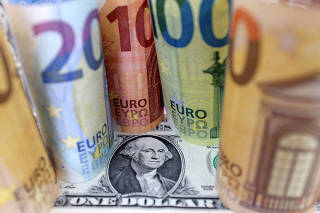 FILE PHOTO: Illustration shows U.S. Dollar and Euro banknotes