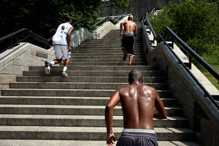 A group runs up stairs while exercising in New York, July 26, 2007. (Todd Heisler/The New York Times)