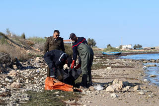 Coastguards retrieve a body, which according to them belongs to a migrant, in Sfax