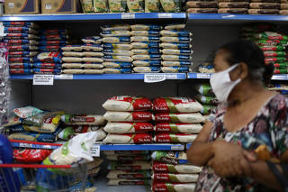 Bags of rice are seen displayed at a supermarket in Rio de Janeiro