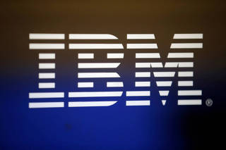 FILE PHOTO: The logo of Dow Jones Industrial Average stock market index listed company IBM (IBM) is seen in Los Angeles