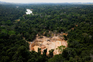 FILE PHOTO: A helicopter of the Brazilian Environmental Agency (IBAMA) is seen near Uraricoera river during an operation at illegal mining in the Yanomami indigenous land