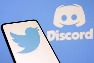 Illustration shows Twitter and Discord logos
