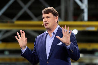FILE PHOTO: Ford CEO Jim Farley speaks during a vehicle launch
