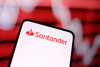 FILE PHOTO: Illustration shows Santander Bank logo and decreasing stock graph