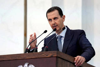 FILE PHOTO: Syria's President Bashar al-Assad addresses the new members of parliament in Damascus
