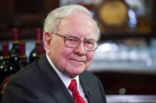 FILE PHOTO: Warren Buffett, Chairman, CEO and largest shareholder of Berkshire Hathaway takes part in interviews before a fundraising luncheon for the nonprofit Glide Foundation in New York