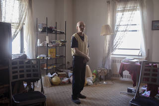 William Mackiw, 82, a Ukrainian immigrant, at his home in the Stewart Hotel in Manhattan, on April 11, 2023. (Kirsten Luce/The New York Times)