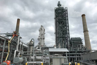 FILE PHOTO: Equipment used to capture carbon dioxide emissions at a coal-fired power plant in Thomspsons