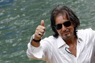 Al Pacino gives a thumbs-up as he leaves after a news conference of his film 