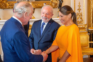 Britain's King Charles greets Brazil's President Luiz Inacio Lula da Silva during an event at Buckingham Palace in London