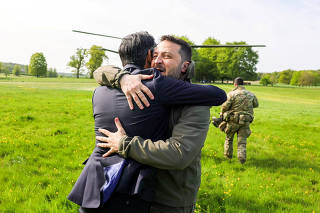British PM Sunak hugs Ukrainian President Zelenskiy in Aylesbury