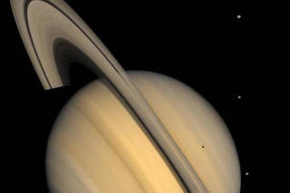 An undated approximate natural-color image provided by NASA of Saturn, its rings, and four of its icy moons. (NASA/JPL/USGS via The New York Times)