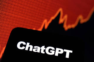 FILE PHOTO: Illustration shows ChatGPT logo and rising stock graph