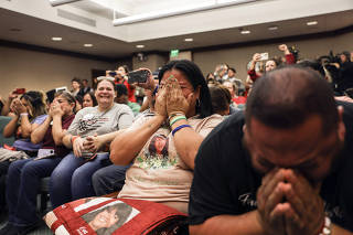 Gloria Cazares and other family members from Uvalde are overcome with emotion after the Texas House Select Committee on Community Safety votes in favor of a bill to raise the minimum age to buy a semiautomatic rifle from 18 to 21 in Austin, Texas on may 8, 2023. (Tamir Kalifa/The New York Times)