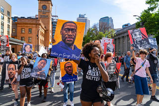 Demonstrators march through downtown Minneapolis near the Hennepin County Government Center, June 25, 2021, after Derek Chauvin?s sentencing. (Aaron Nesheim/The New York Times)
